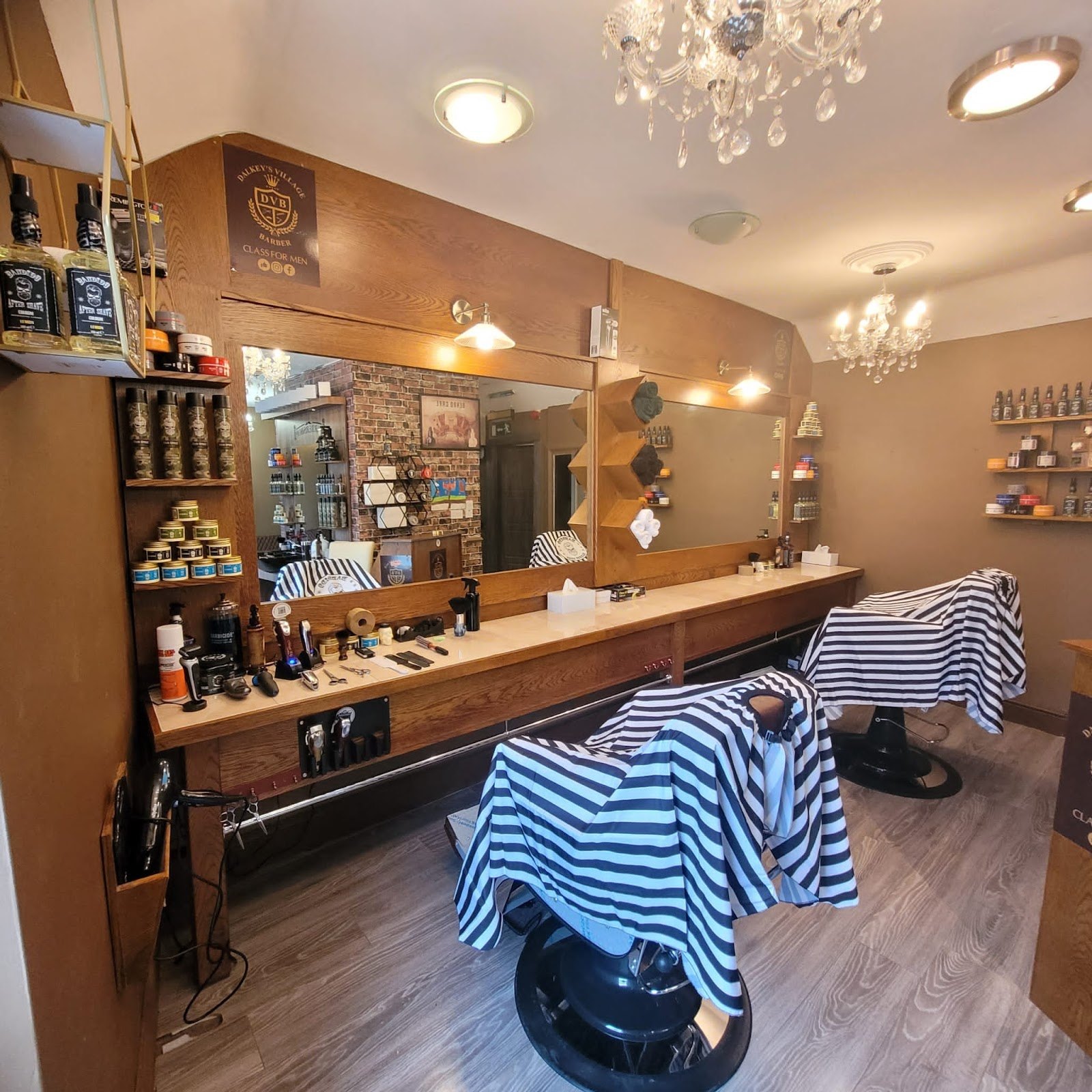 Two barber chairs and a wooden station inside Dalkey barbers on Castle Street